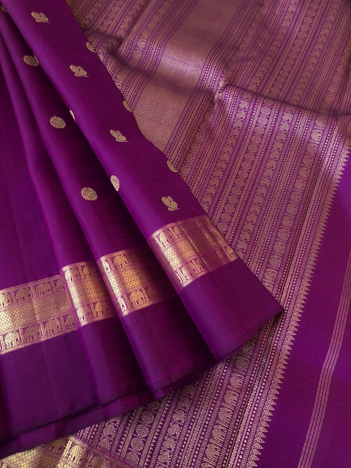 Tara - Traditional Colours on Traditional Kanchivarams - gorgeous deep dark purple mayil chackaram woven buttas with solid gold zari woven borders and intricate woven pallu