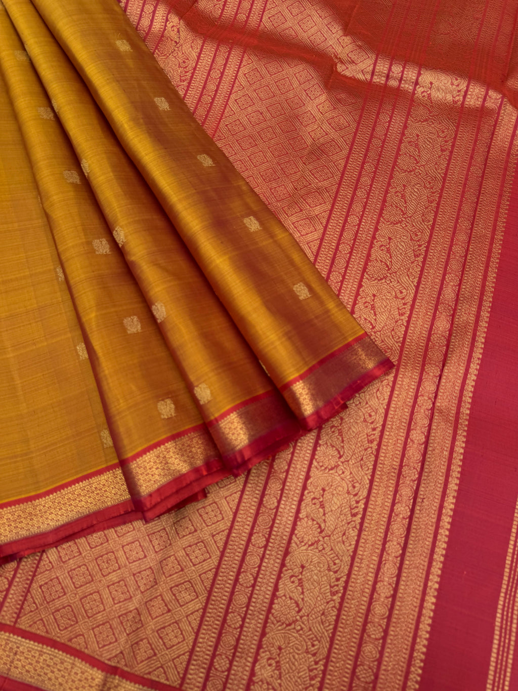 Leela - The bliss of small border Kanchivarams - rust honey and mustard dual tone body with red pallu and buttas woven pallu