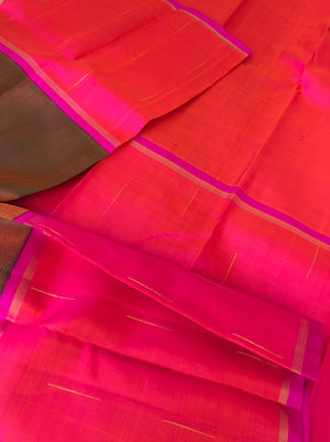 Meenakshi - Kanchivaram for Every Occasion - stunning copper tone body mubbagam with orangish pink rain drops woven borders