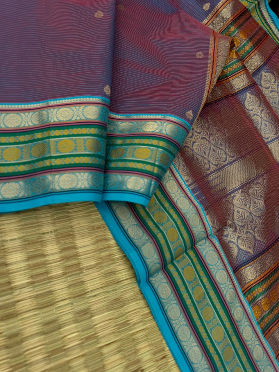 Zari Kissed Silk Cotton - a deep red short blue with laddu Kamalam motifs woven borders