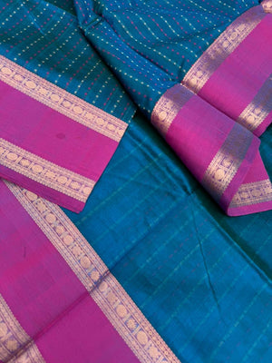 Woven Motifs Silk Cotton - a dark peacock blue lakshadeepam with retta pett woven borders
