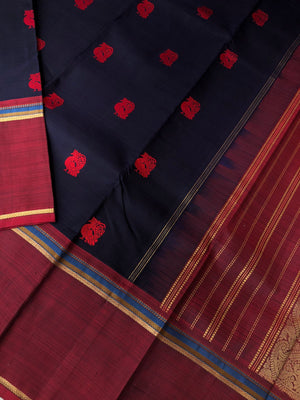 Kaavyam on Kanchivaram - the one of a kind deep mid night black blue body with annapakshi woven buttas with deep maroon borders pallu and blouse