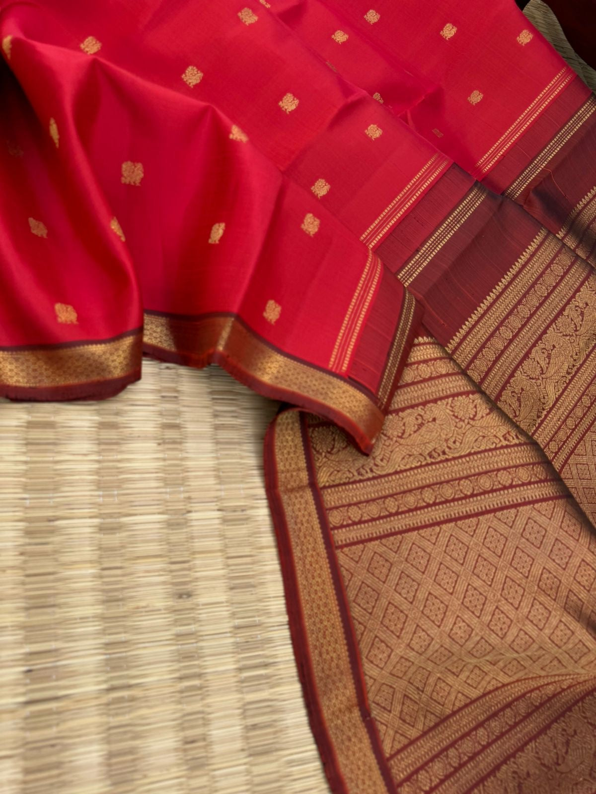 Leela - The bliss of small border Kanchivarams - brick red and maroon the best part of the saree is blouse has woven buttas