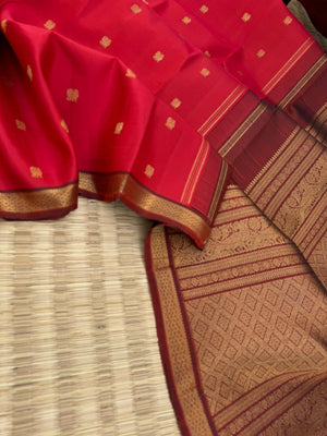 Leela - The bliss of small border Kanchivarams - brick red and maroon the best part of the saree is blouse has woven buttas
