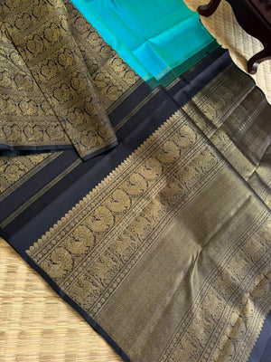 Tasteful Tall Border Kanchivarams - lovely dual tone blue and black with long zari woven one side korvai borders with grand pallu