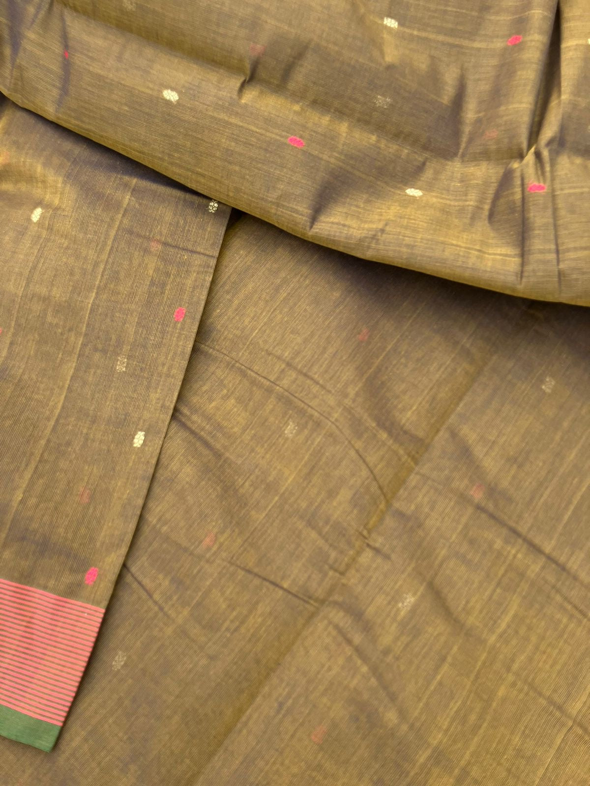 Mangalavastaram - a unique bronze tone with tiny woven buttas