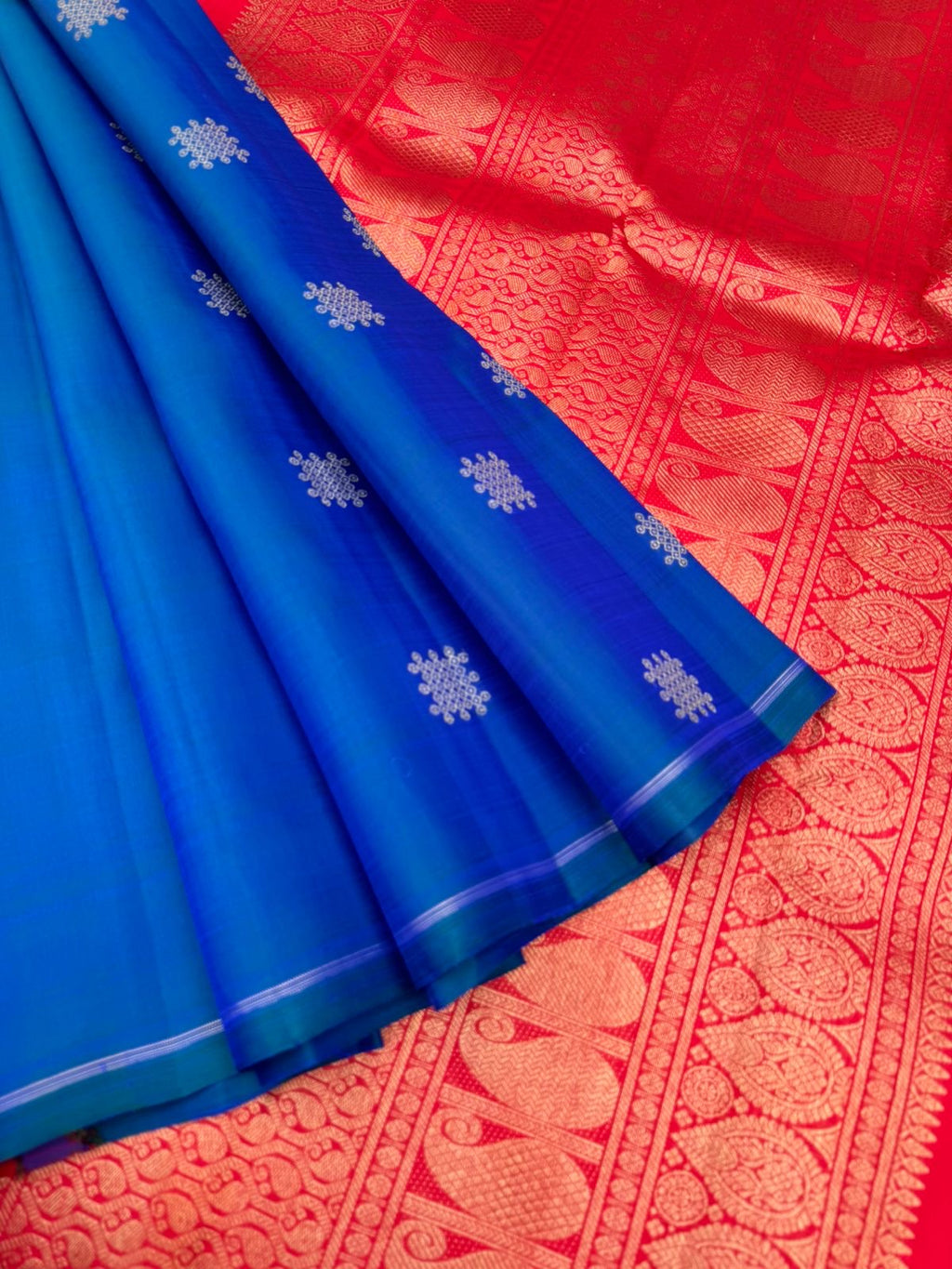 Colour Play on Kanchivaram - peacock blue green kolam buttas woven body with red tone woven pallu and blouse