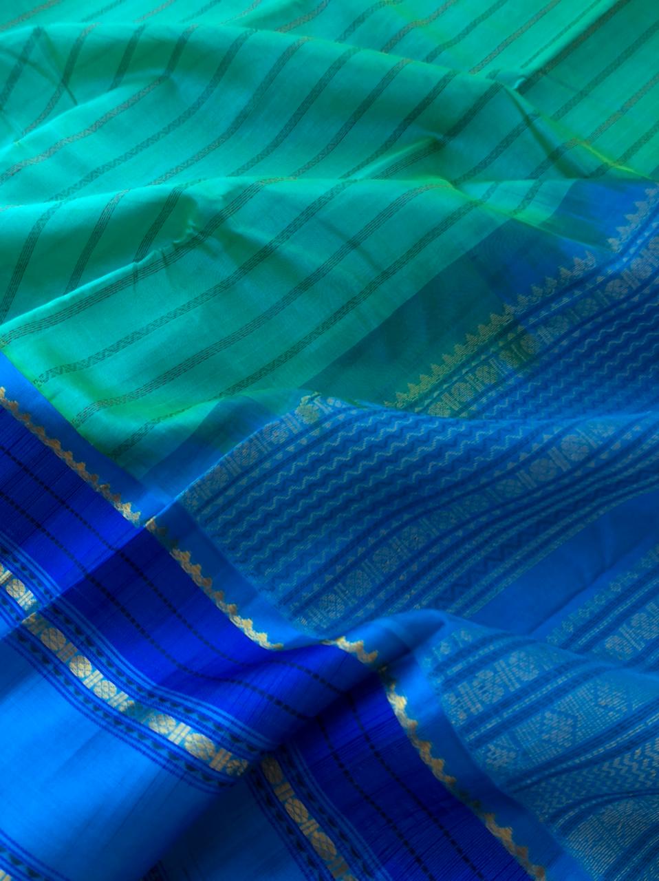 Divyam - Korvai Silk Cotton with Pure Silk Woven Borders - dual tone aqua teal blue on blue with vertical veldhari