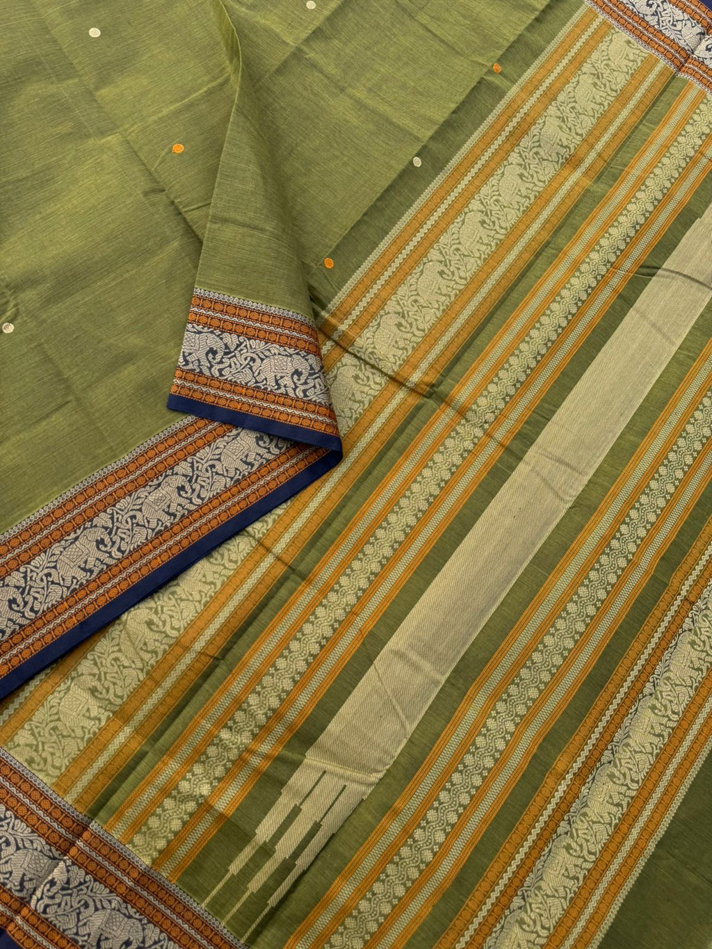Mangalavastaram - a stunning deep algae green with elephant woven borders