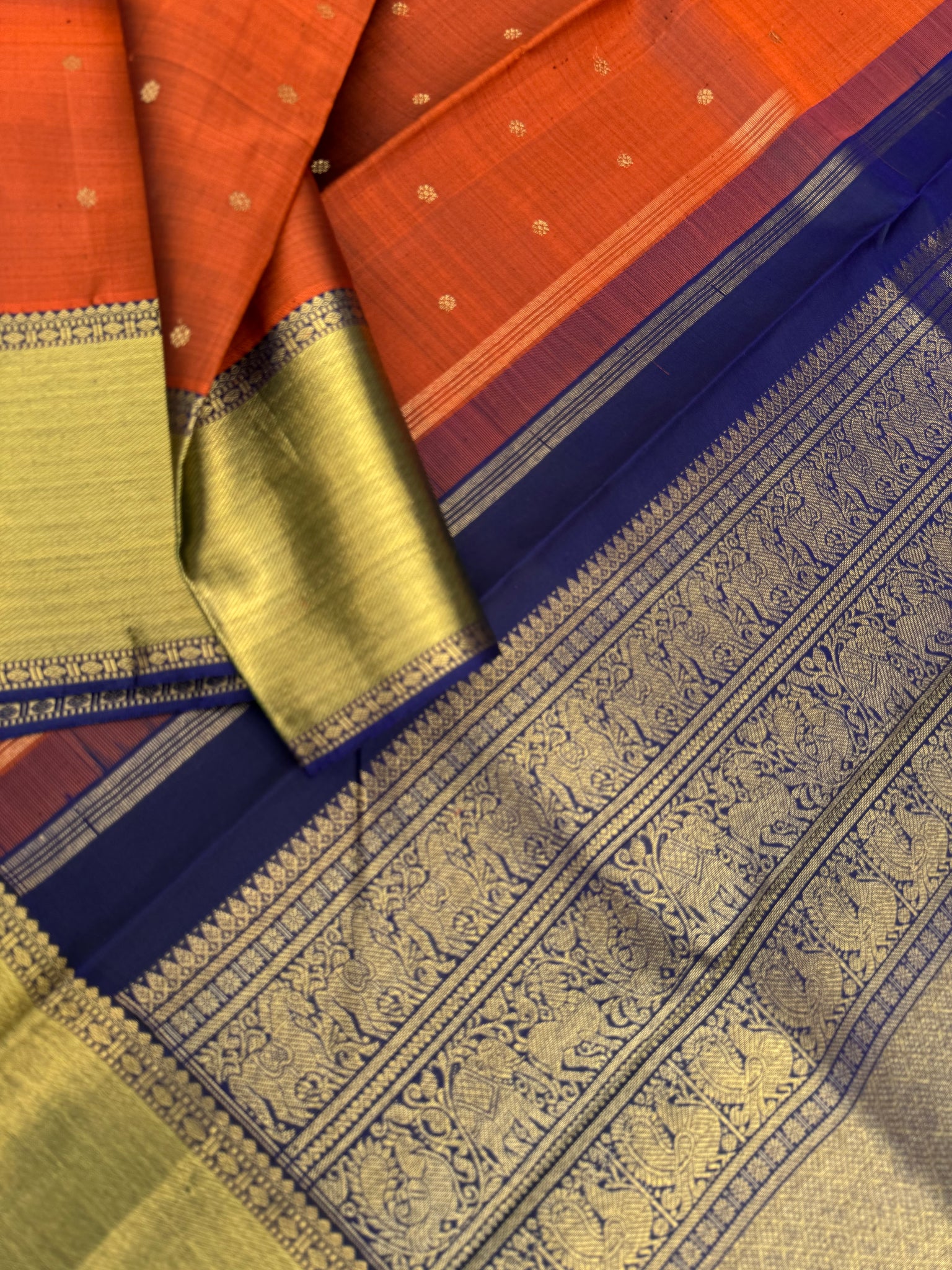 Molten Play on Kanchivaram - stunning Molten Metallic rusty caramel brown and navy blue with grander version of pallu and borders