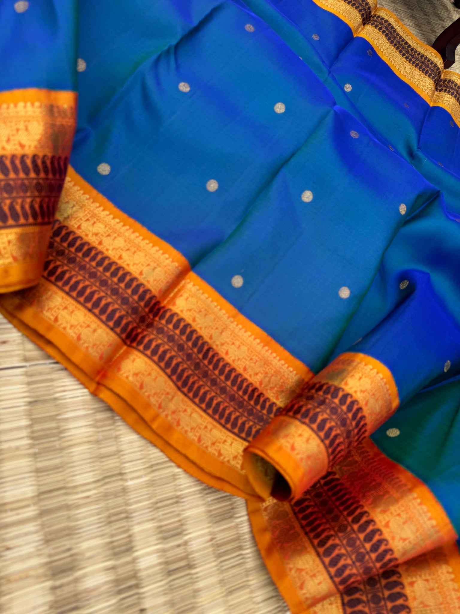 Aarambam - Where Tradition Begins - a classy peacock blue green body with vintage mustard zari and silk thread woven borders and pallu