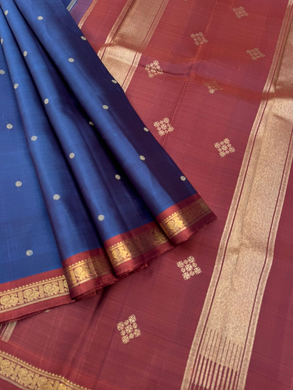 Leela - The bliss of small border Kanchivarams - rusty blue a unusual and rare tone with gorgeous chocolate tone pallu and blouse