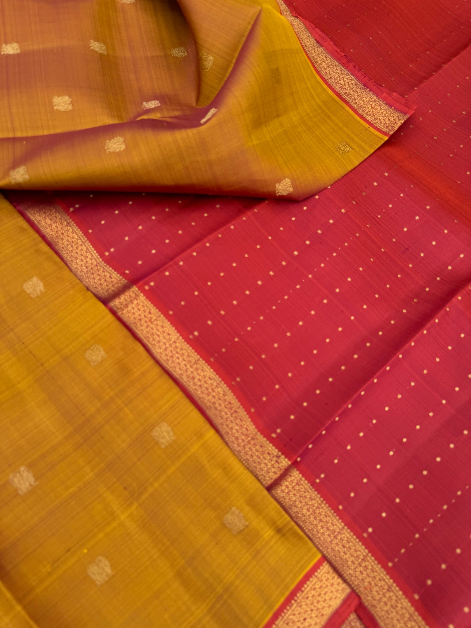 Leela - The bliss of small border Kanchivarams - rust honey and mustard dual tone body with red pallu and buttas woven pallu