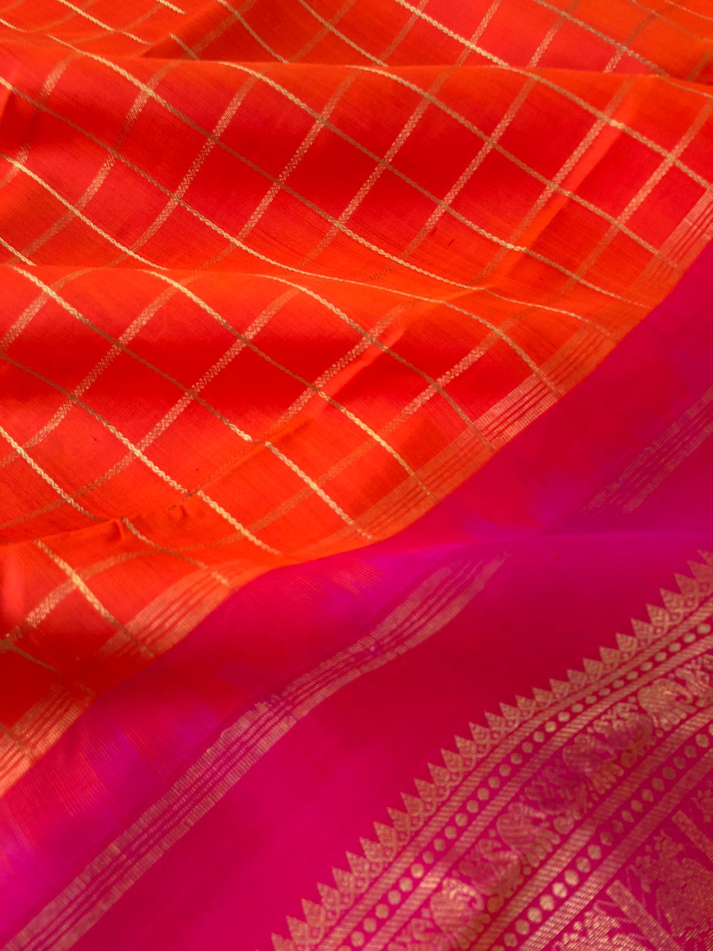 Leela - Limited Edition of Kanchivarams - at the most beautiful traditional solid orange and pink veldhari chex woven body with detailed intricate woven pallu