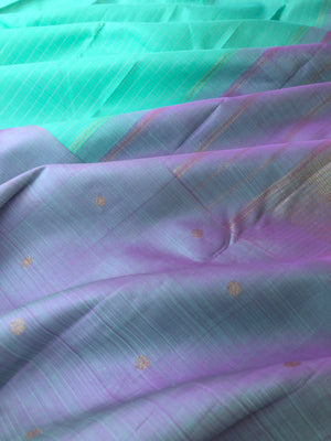 Radha Ragasiyam - Uniquely Woven Kanchivarams - a beautiful kind of sea green/pista green with broad lavender buttas woven borders
