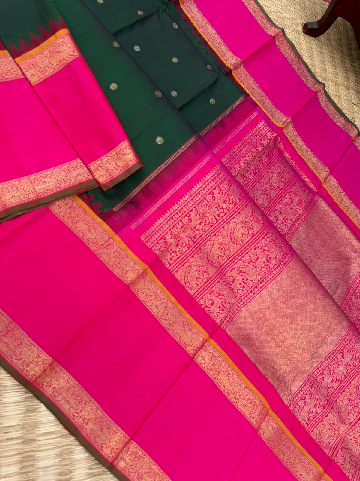 Colour Play on Kanchivaram - deep dark green and pink with broad korvai woven borders