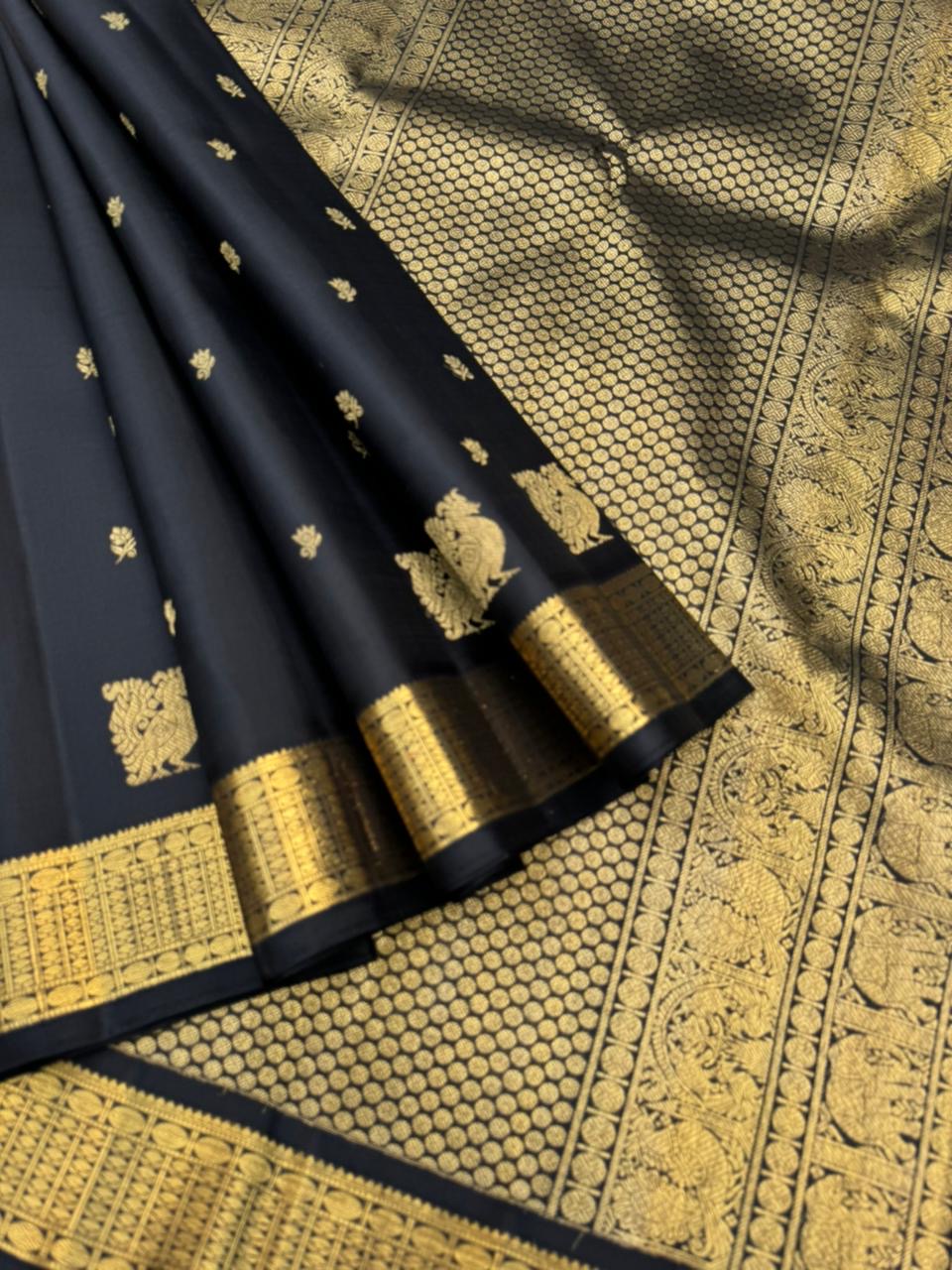 Vintage Ragas on Kanchivaram - a rarest gem of this collection, a full black and gold with old charm bettu buttas woven borders