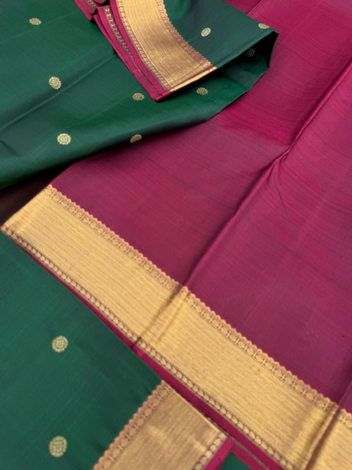 Colour Play on Kanchivaram - the beautiful deep dark meenakshi green with aaraku pallu and blouse with solid gold zari woven borders