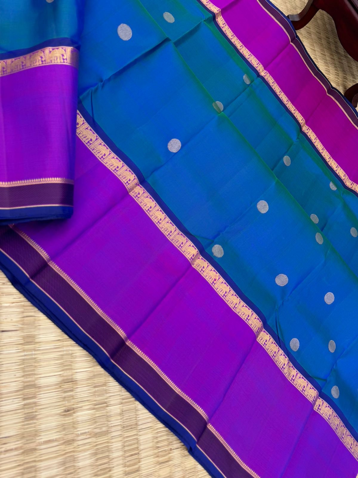Colour Play on Kanchivaram - stunning peacock blue green dual tone body with violet tone broad woven borders