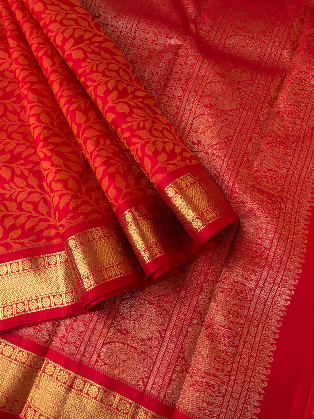 Yarn Play on Kanchivaram - the beautiful of deep red and gold with leave motifs woven all over the body