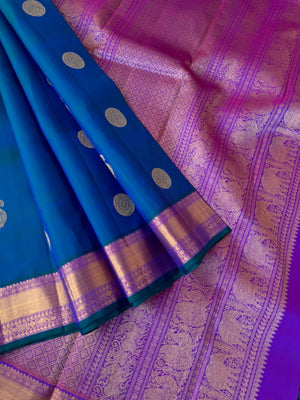 Swarnam - Stunning Solid Border Kanchivarams - the dual tone effect of peacock blue and violet purple