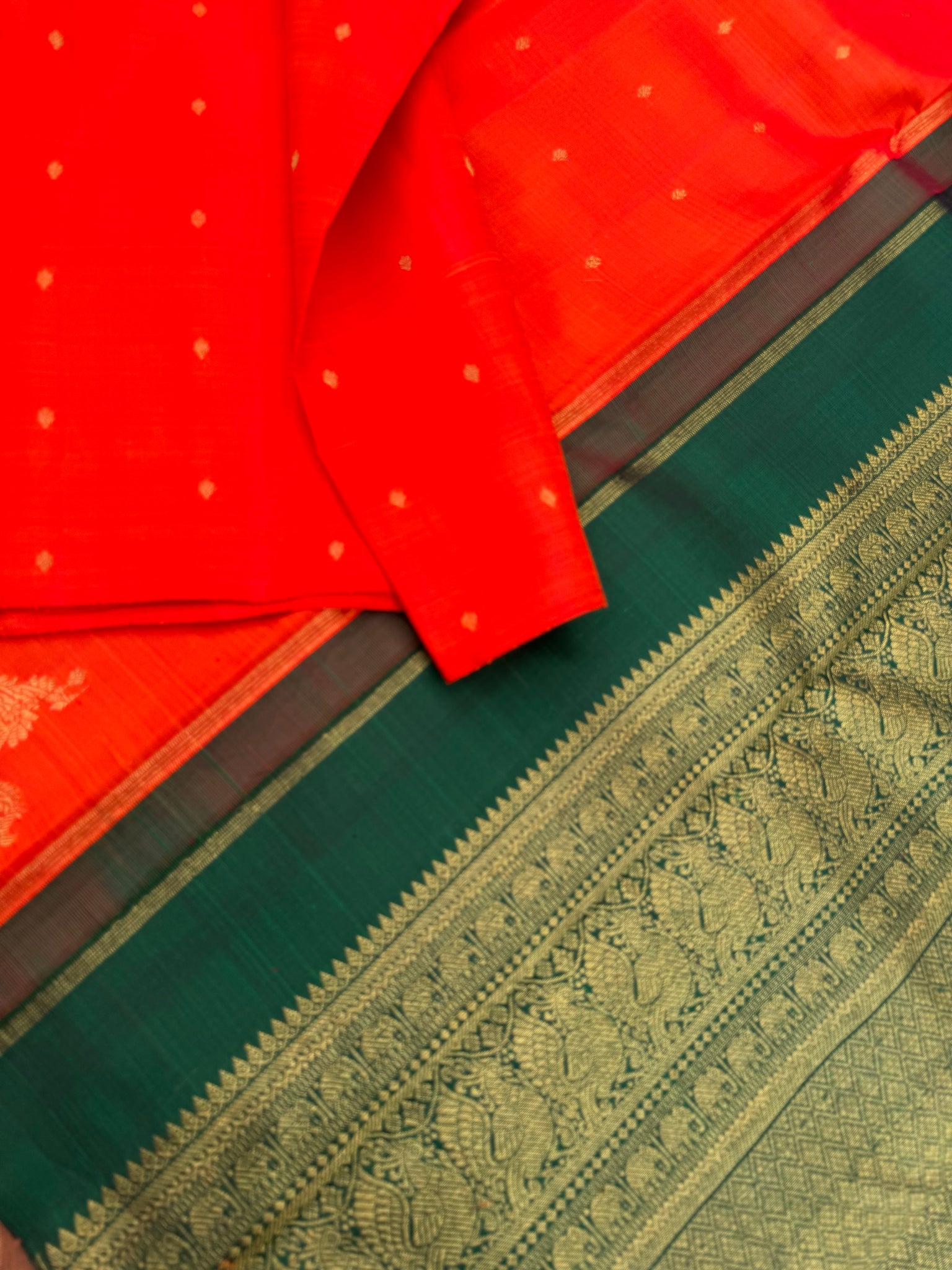 Mohaa - Beautiful Borderless Kanchivaram - most beautiful striking orange and Meenakshi green grand woven pallu and a corner buttas