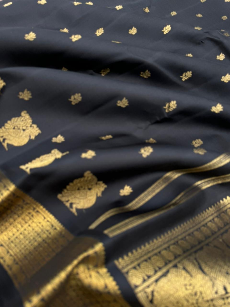 Vintage Ragas on Kanchivaram - a rarest gem of this collection, a full black and gold with old charm bettu buttas woven borders