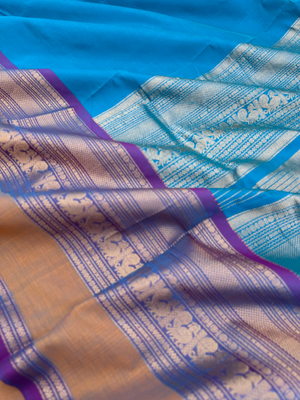 Zari Kissed Silk Cotton - a stunning sulphate anandha blue with grandest borders and pallu