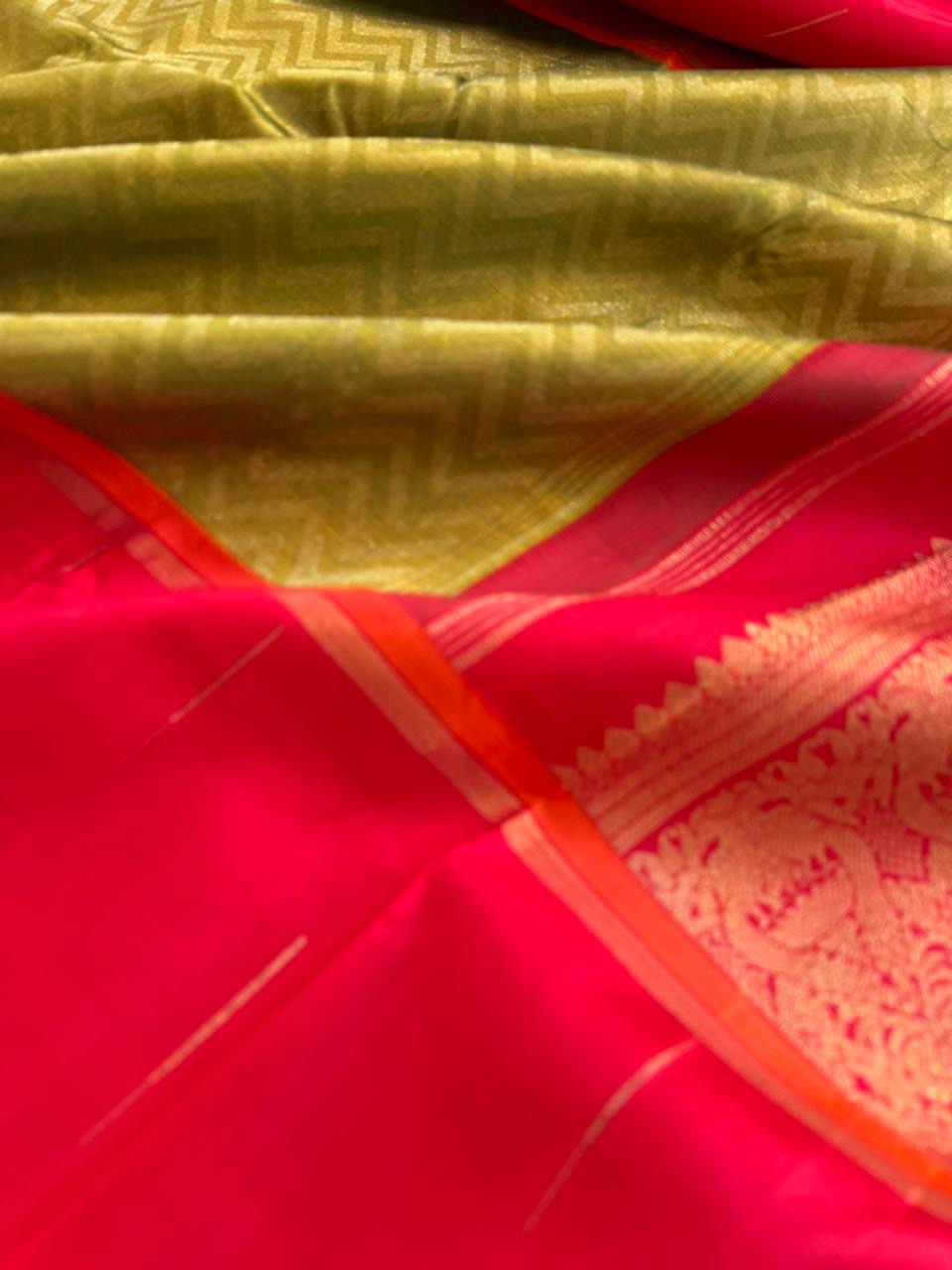 Tasteful Tall Border Kanchivarams - beautiful green and gold full body chevron V pattern with tomato red long korvai woven borders