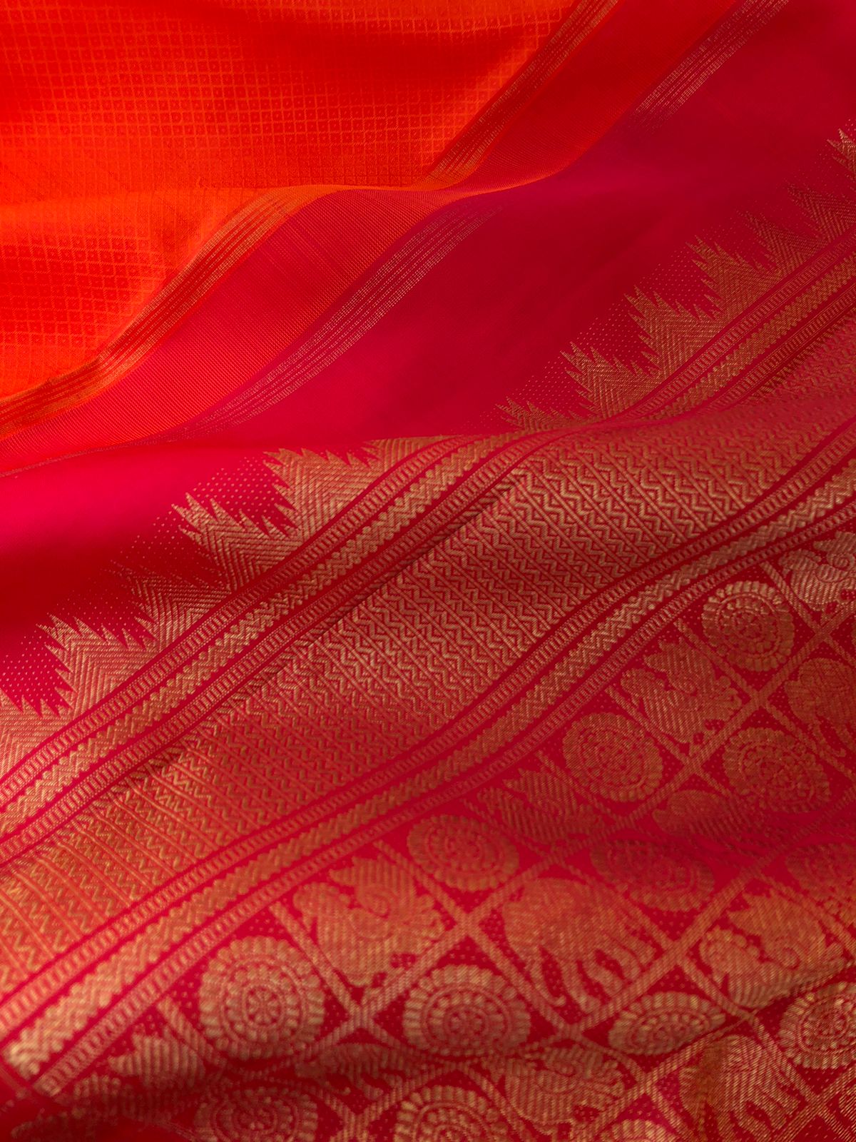 Yarn Play on Kanchivaram - orange and deep red with self weave woven body with chex buttas woven borders