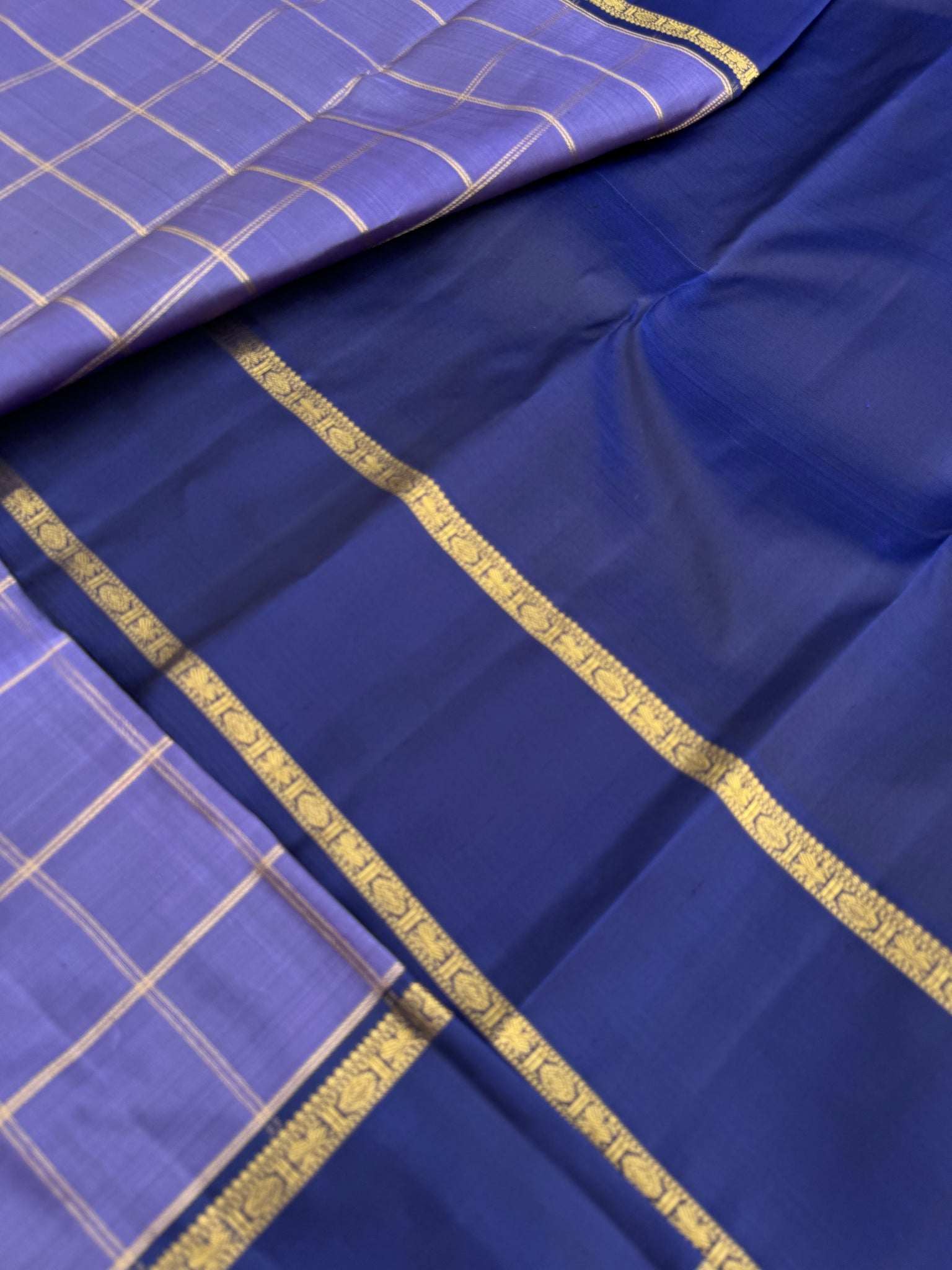 Molten Play on Kanchivaram - a most gorgeous metallic deep lavender and navy blue with kattam woven body and unique pallu