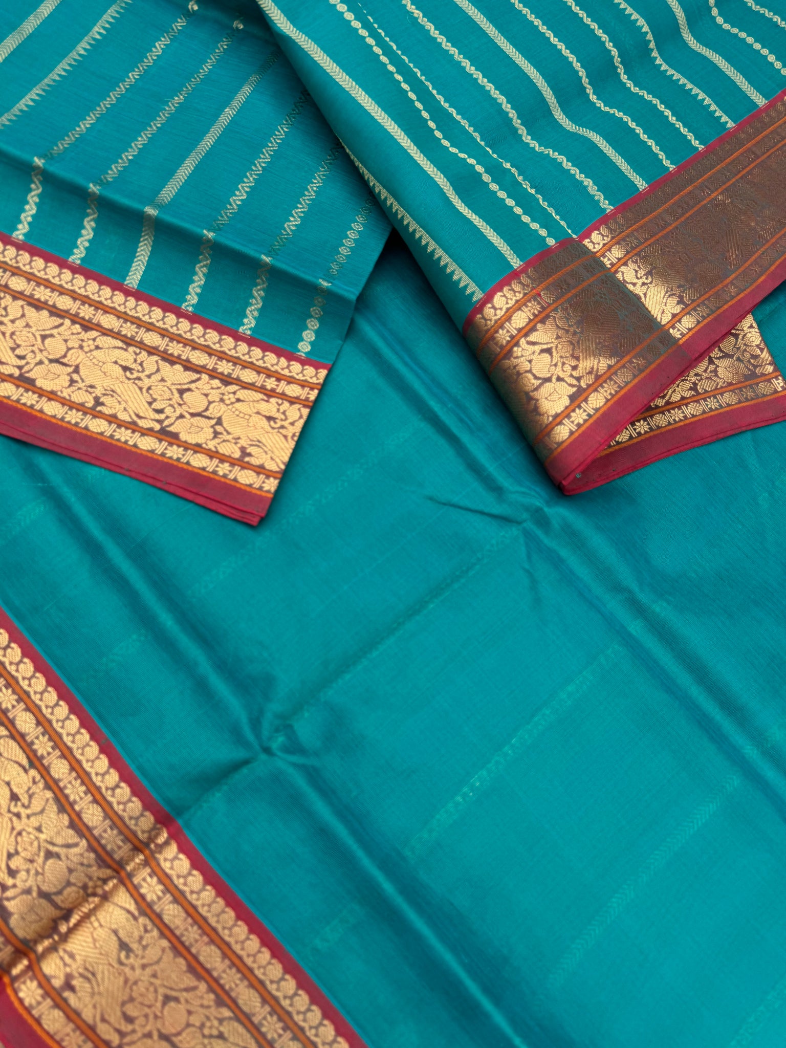 Zari Kissed Silk Cotton - teal vertical veldhari with parrots woven motifs