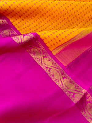 Essence of Traditional Kanchivarams - a gorgeous vintage type broad borders mustard and sweet pink full body woven pluse buttas