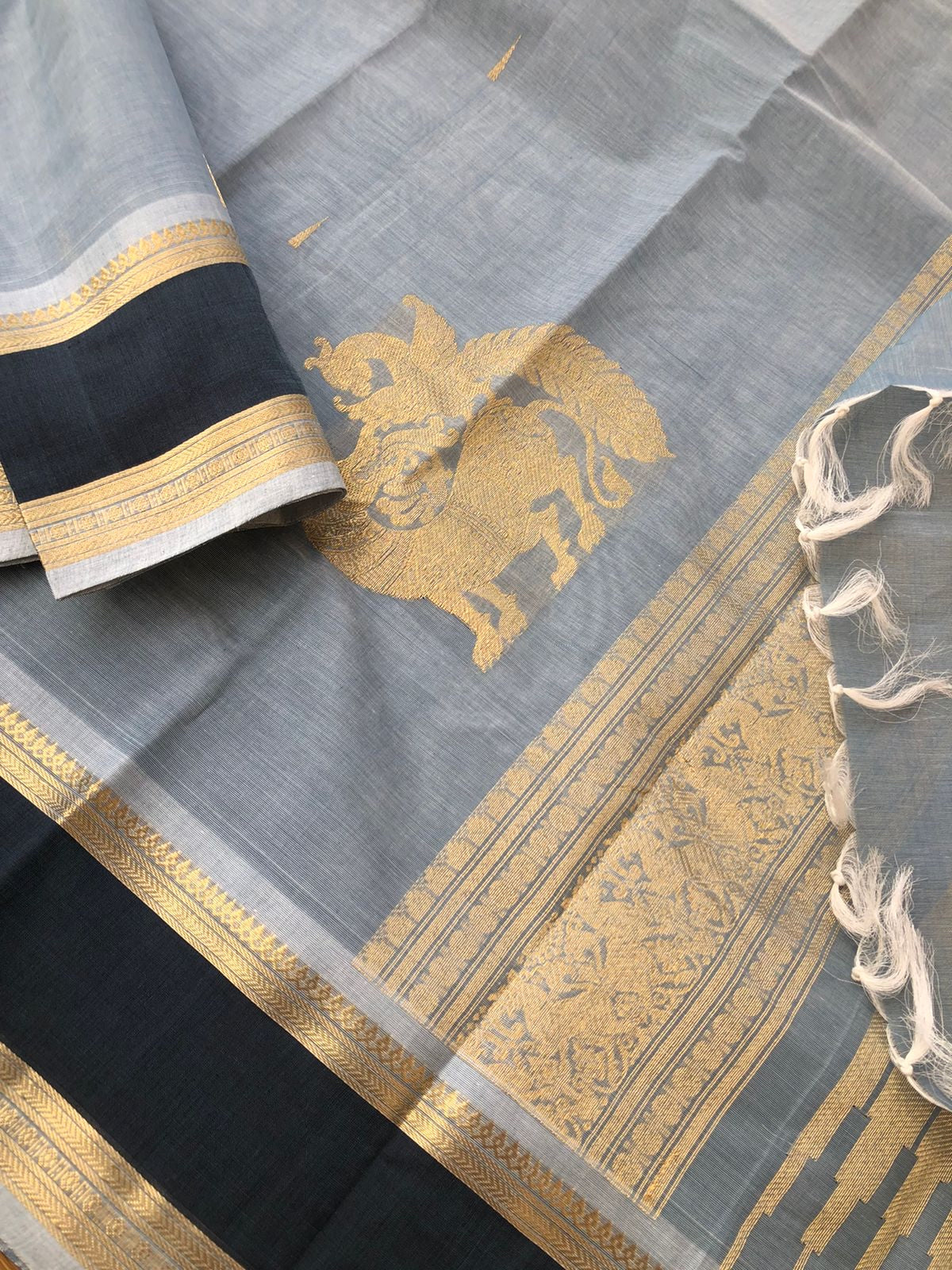 Mangalavastaram - Zari Touched - bluish grey with yali and killi woven corner buttas