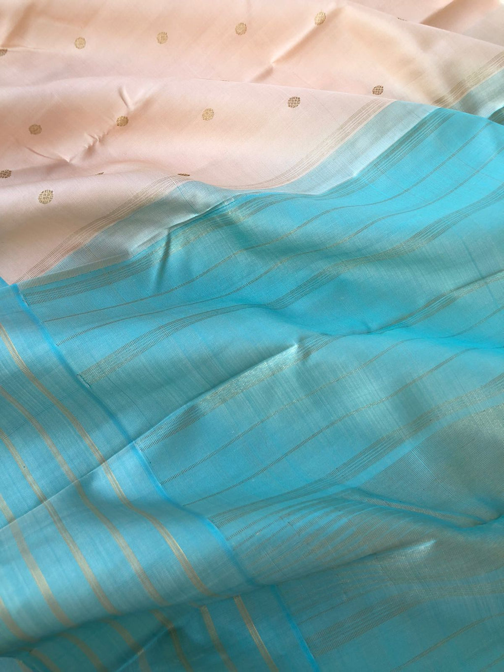 Pastel Ragas on Kanchivaram - most beautiful classy smart pastel off white with a pink of rose gold tone body with baby blue borders pallu and blouse