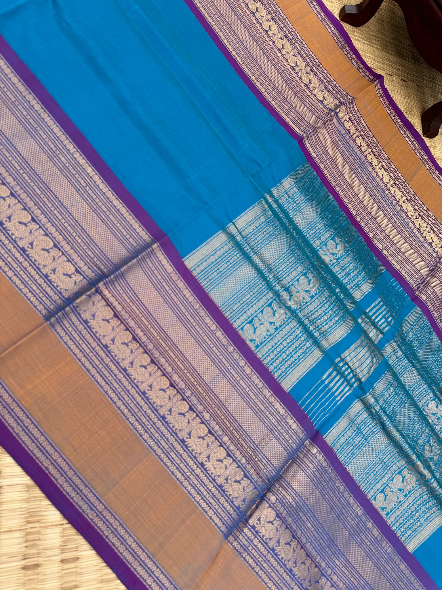 Zari Kissed Silk Cotton - a stunning sulphate anandha blue with grandest borders and pallu