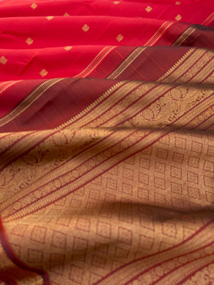 Leela - The bliss of small border Kanchivarams - brick red and maroon the best part of the saree is blouse has woven buttas