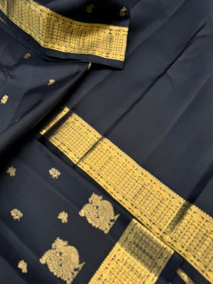 Vintage Ragas on Kanchivaram - a rarest gem of this collection, a full black and gold with old charm bettu buttas woven borders