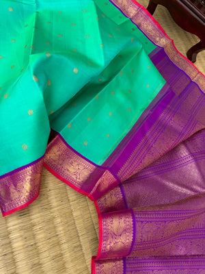 Tales of Korvais Kanchivaram - the stunning dual tone aqua blue green with violet yali and annapakshi woven borders