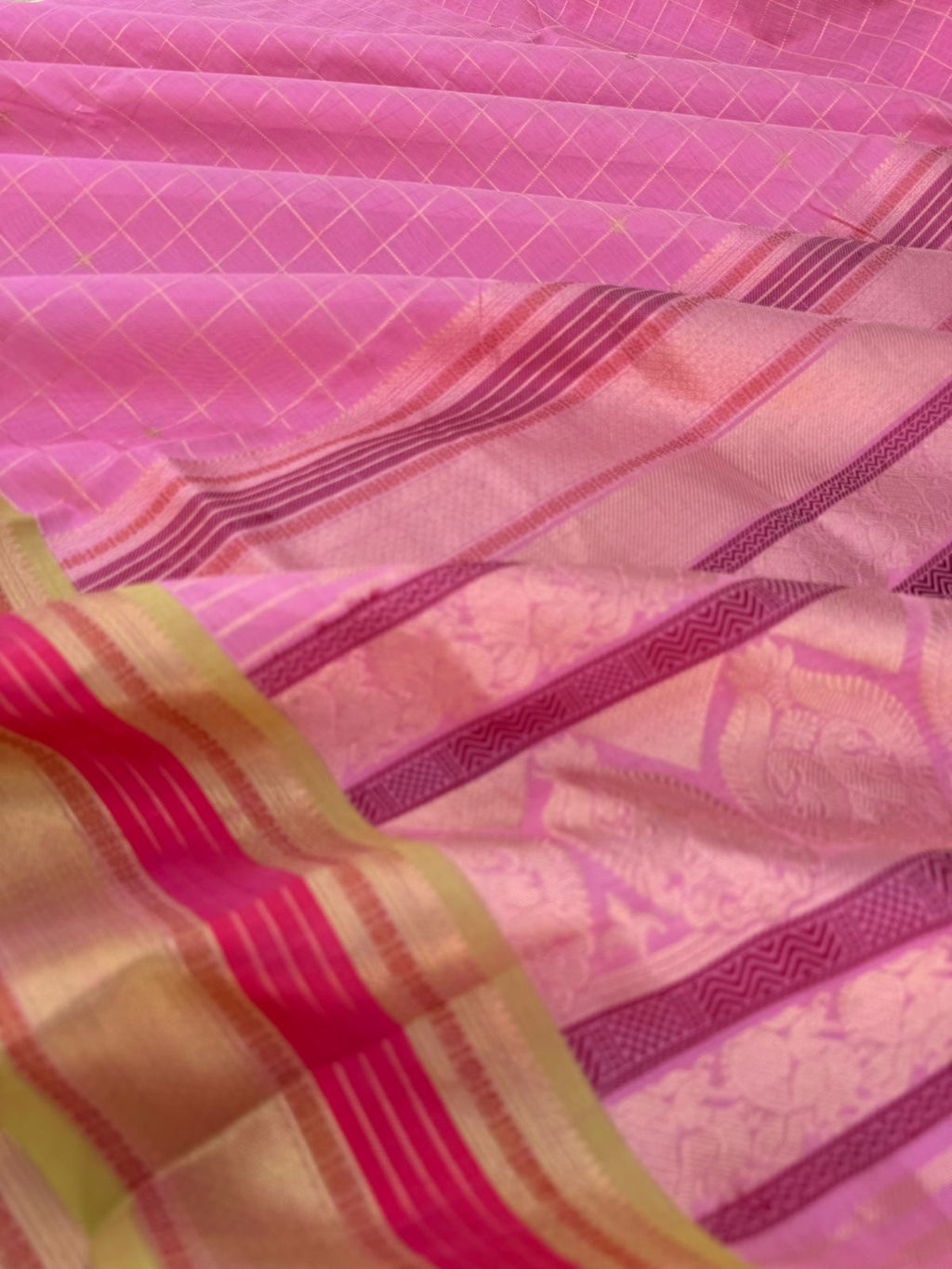Pastels on Zari Kissed Silk Cotton - a stunning pastel baby pink with muthukattam and buttas woven together