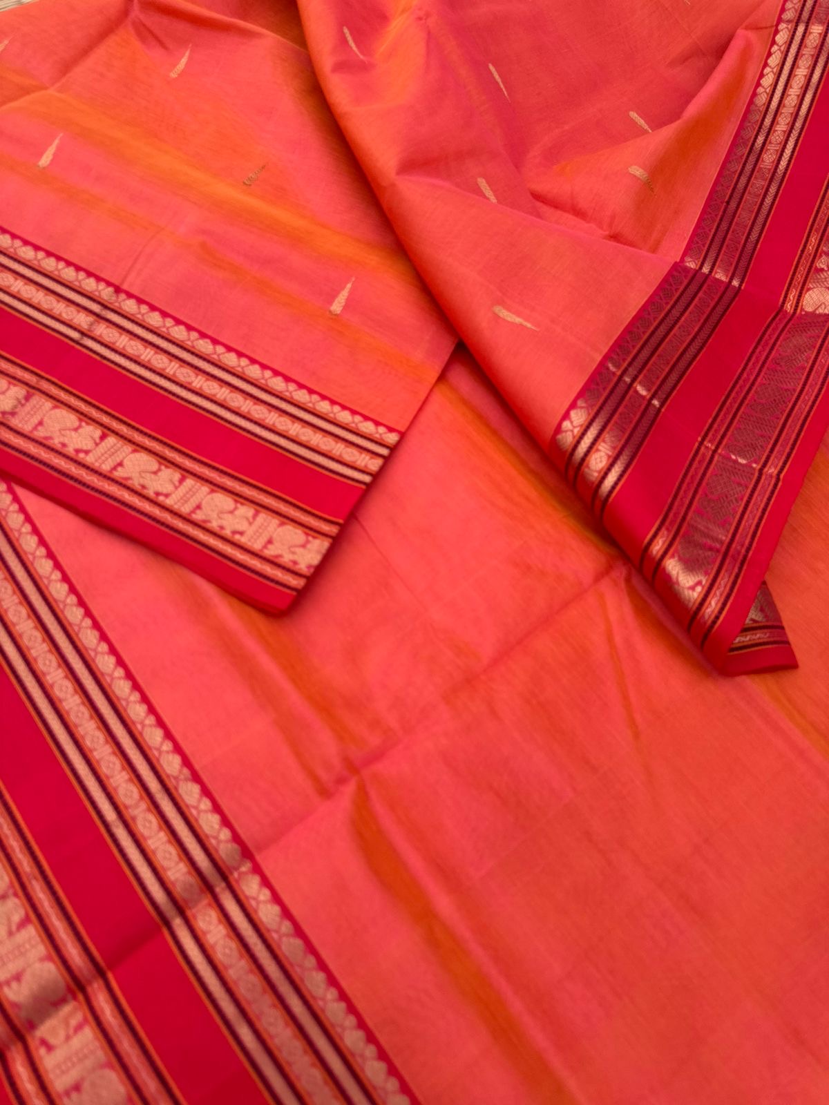 Zari Kissed Silk Cotton - a peach kanakambaram rain drop woven buttas