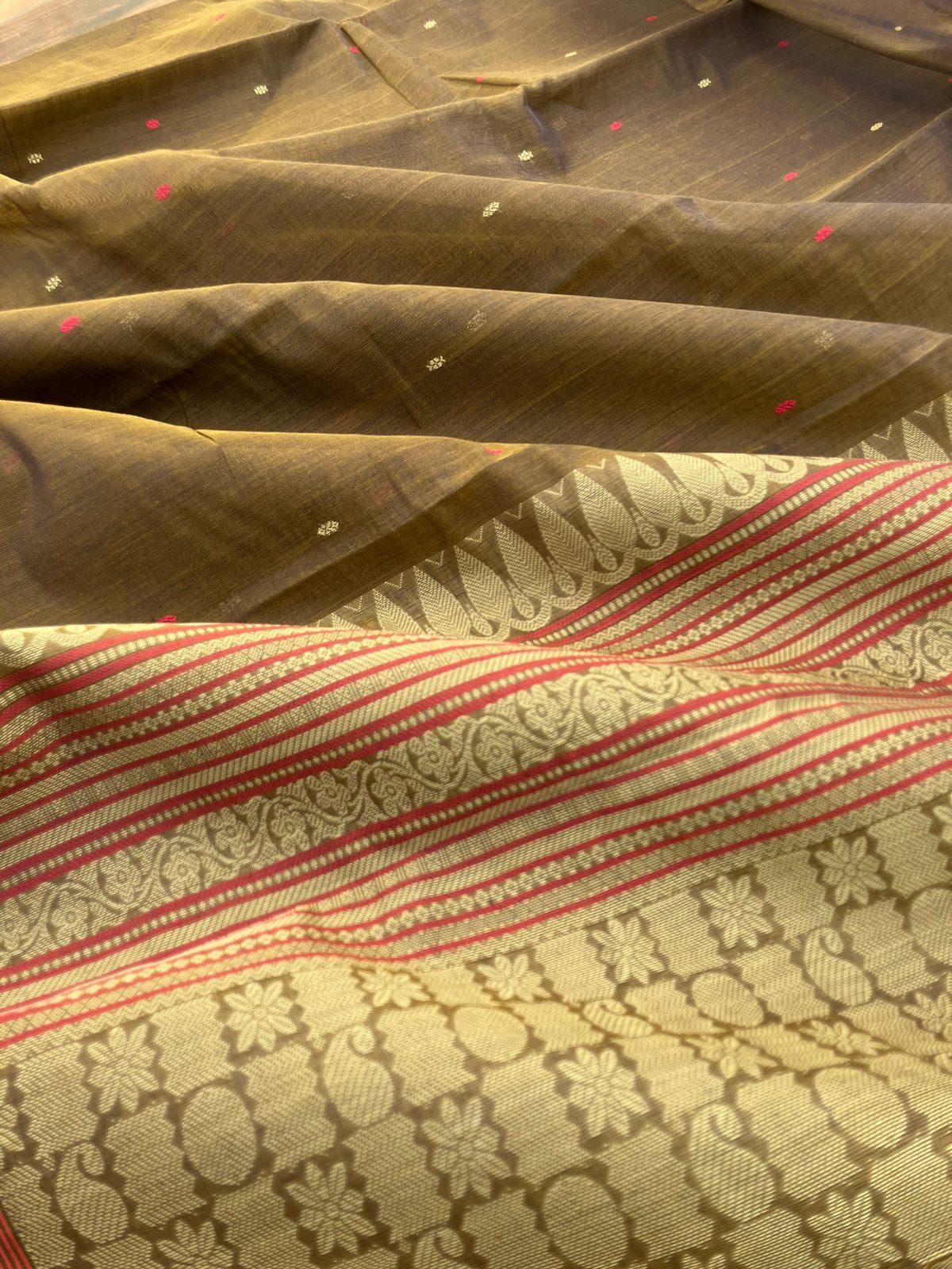 Mangalavastaram - a unique bronze tone with tiny woven buttas