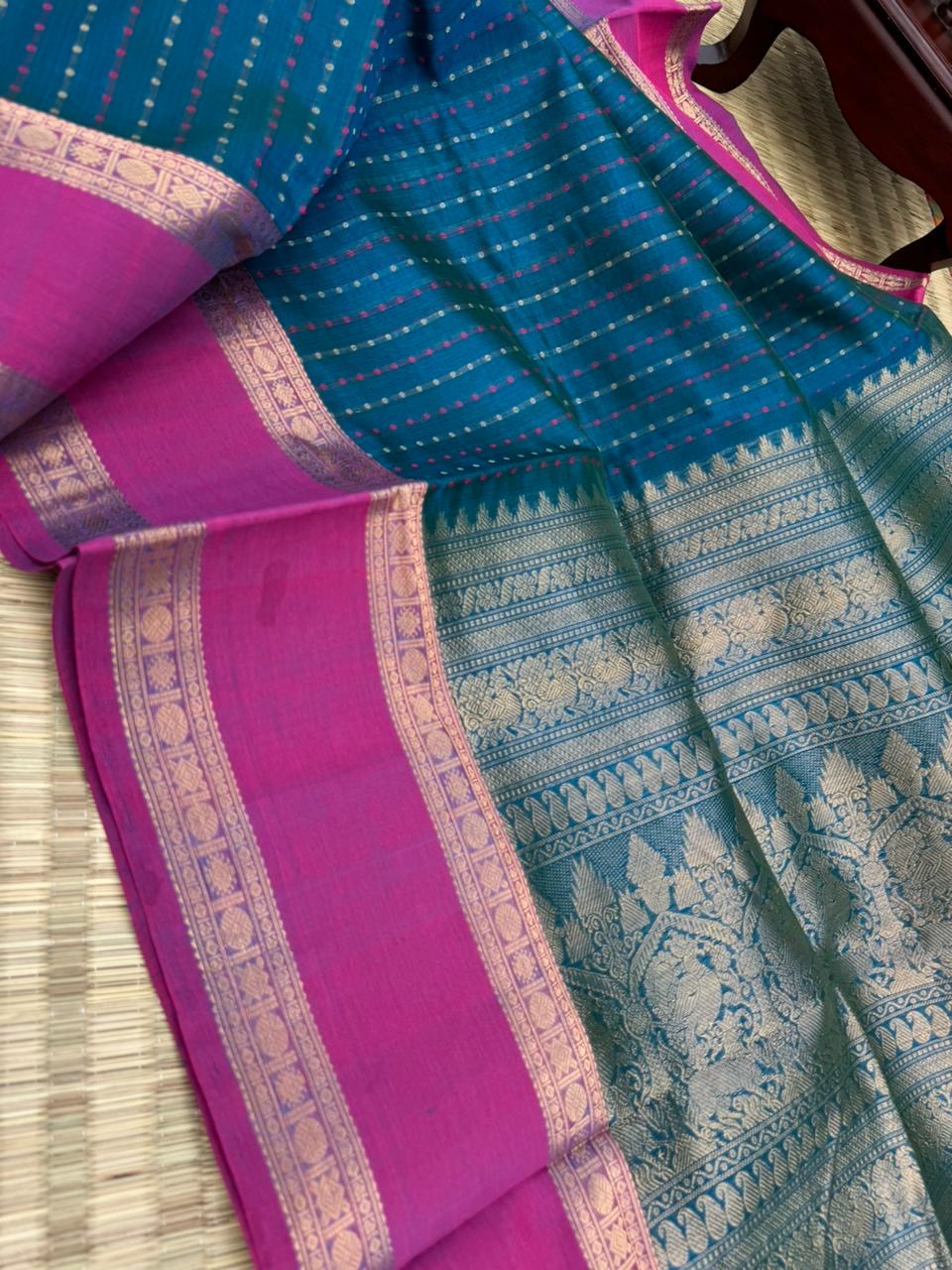 Woven Motifs Silk Cotton - a dark peacock blue lakshadeepam with retta pett woven borders