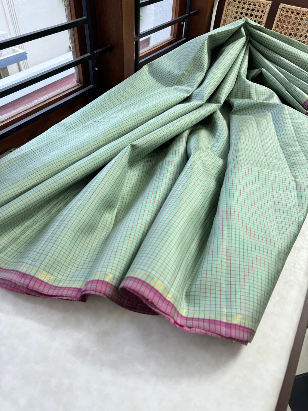 Adhyayam – The No Motifs Kanchivaram - a stunning pastel pista green podi kattam with rain pink pallu and blouse