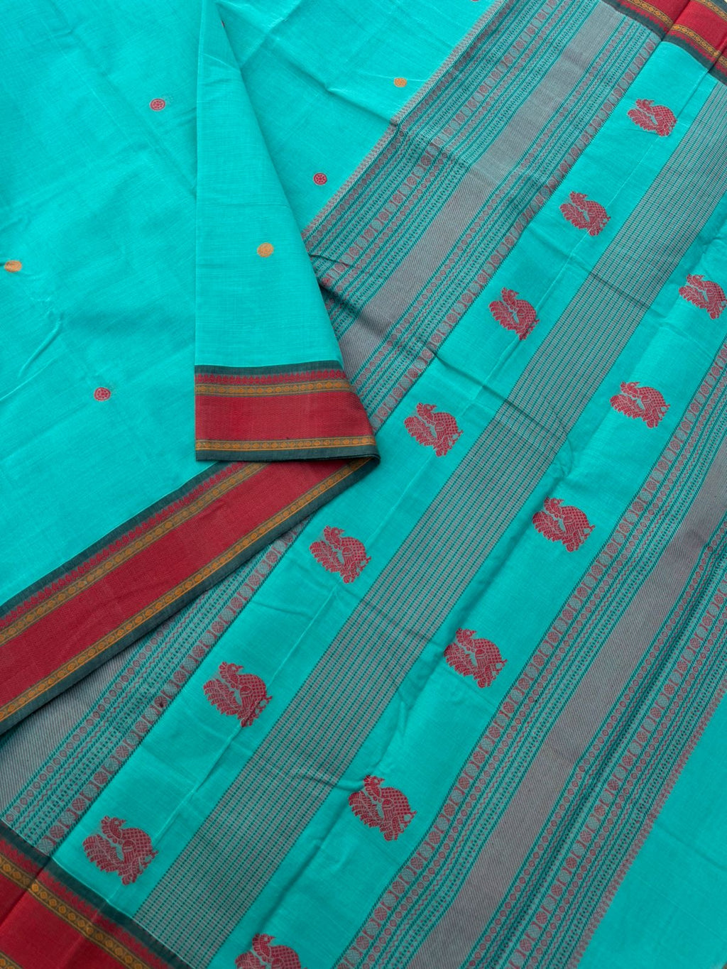 Mangalavastaram - a teal blue with woven maadam motif borders
