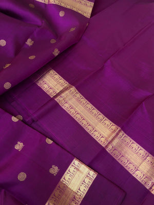 Tara - Traditional Colours on Traditional Kanchivarams - gorgeous deep dark purple mayil chackaram woven buttas with solid gold zari woven borders and intricate woven pallu