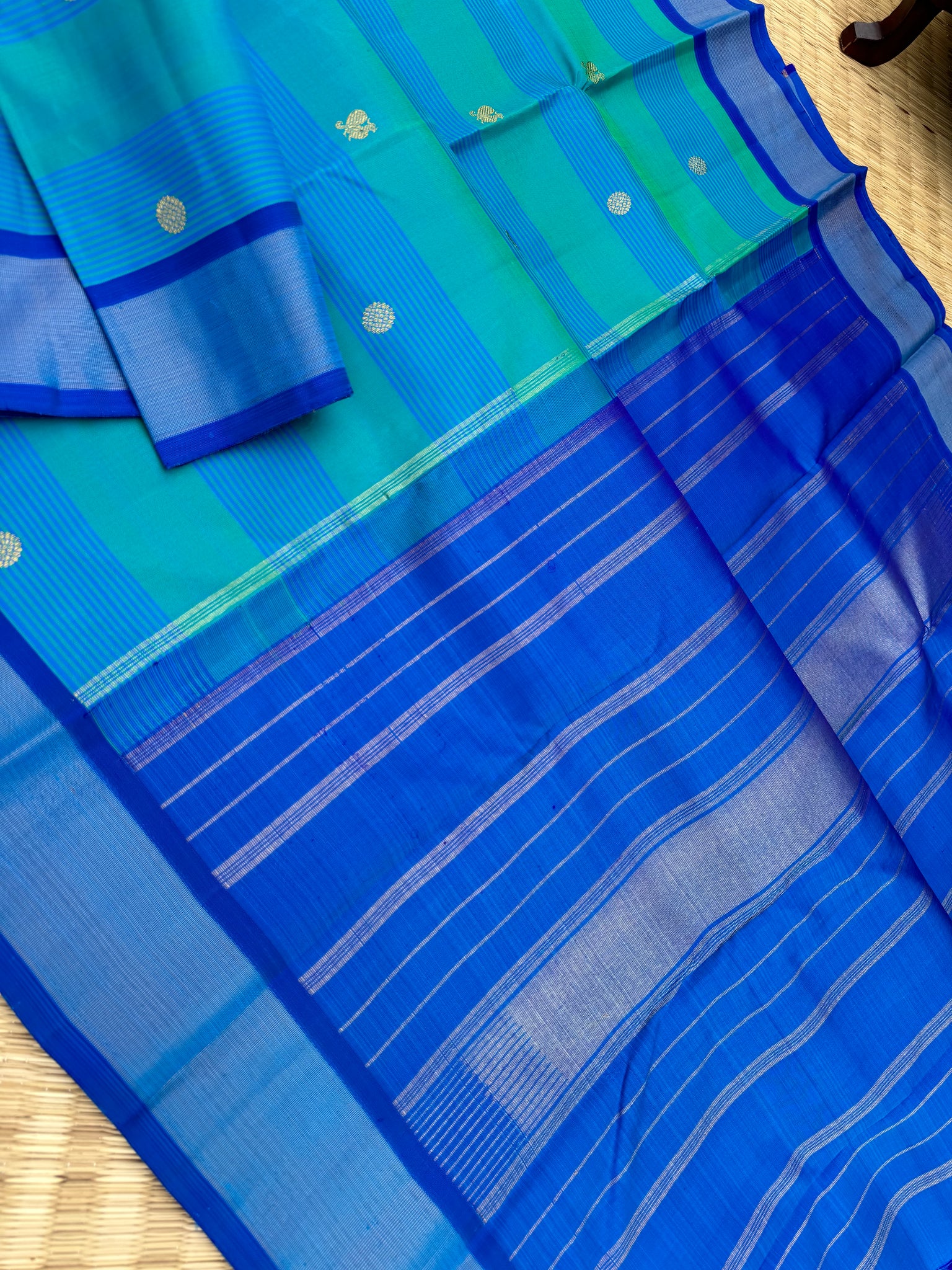 Album Untouched - a gorgeous teal and ananda blue body with mayil chackaram woven buttas