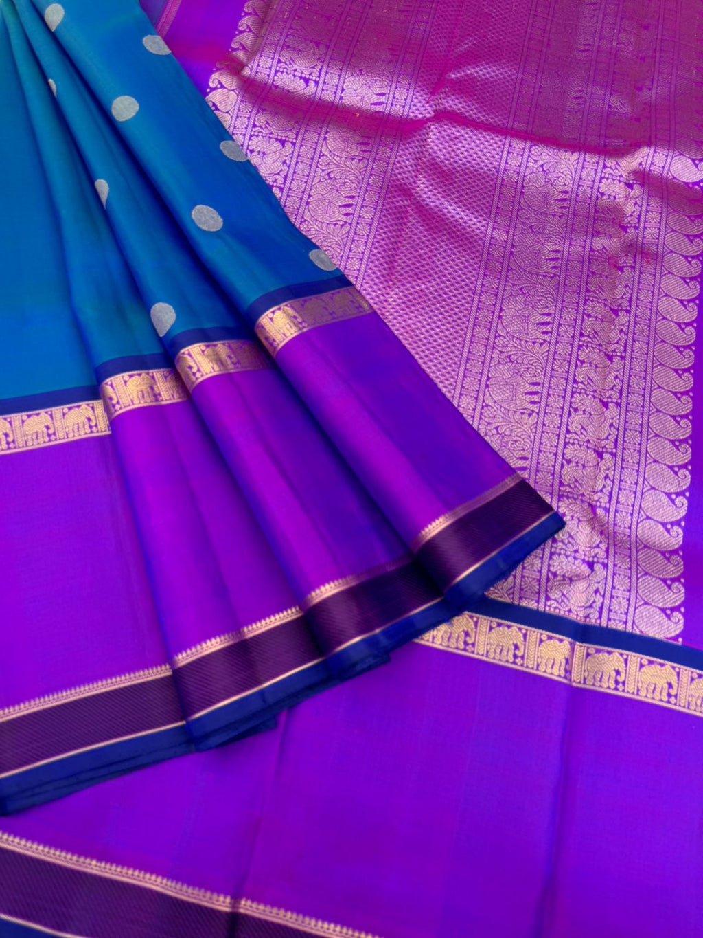Colour Play on Kanchivaram - stunning peacock blue green dual tone body with violet tone broad woven borders