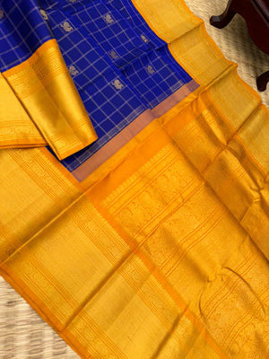 Colours of Navarathri 2025 on Kanchivaram - most grandest and most solid deep blue and golden mustard Korvai Kanchivaram with full gold zari woven broad borders with mayil chackaram woven buttas