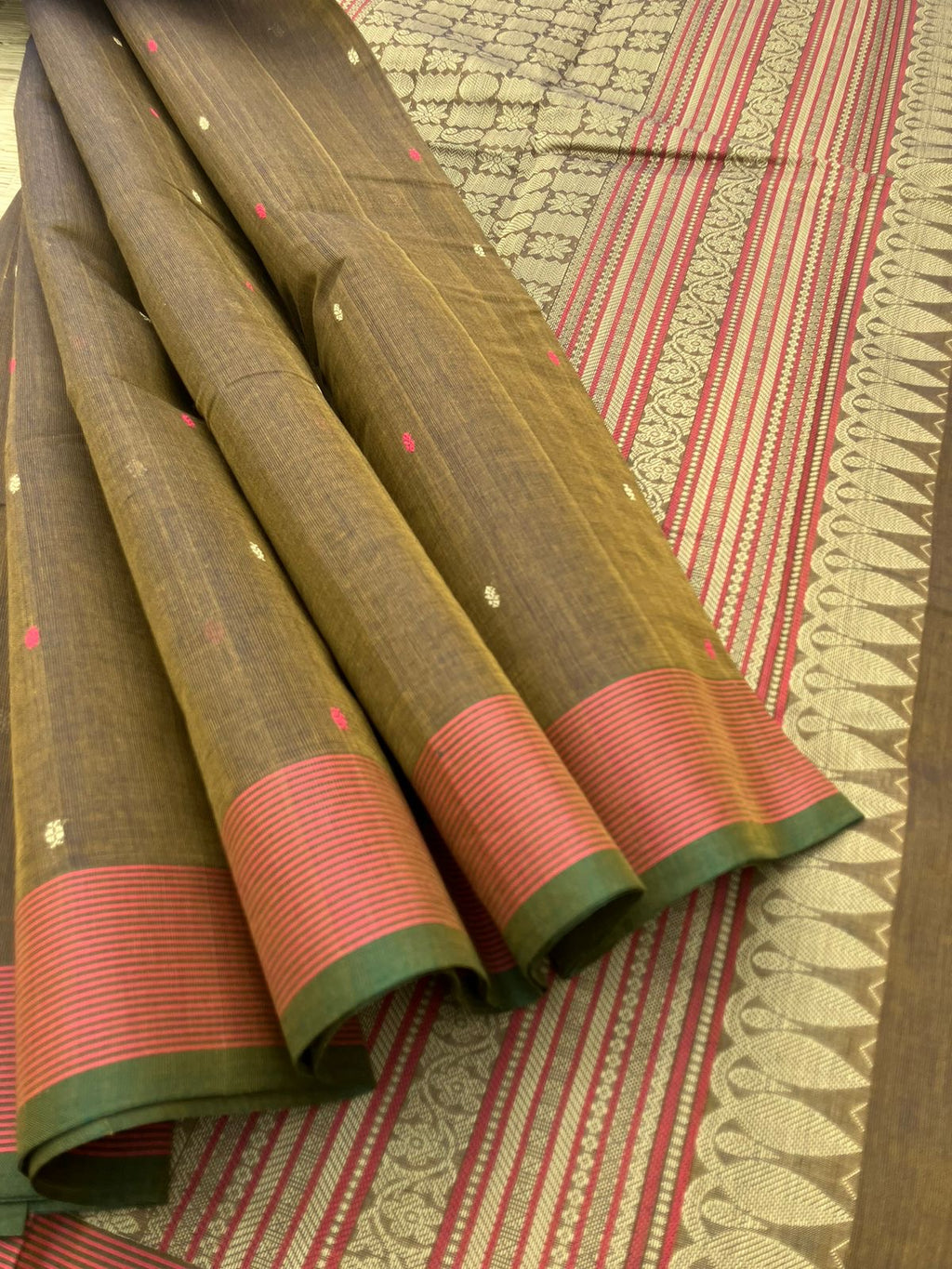 Mangalavastaram - a unique bronze tone with tiny woven buttas